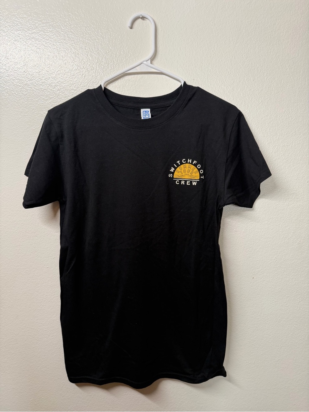 Switchfoot Crew Black Short Sleeve Logo Tee with Yellow Chest Emblem